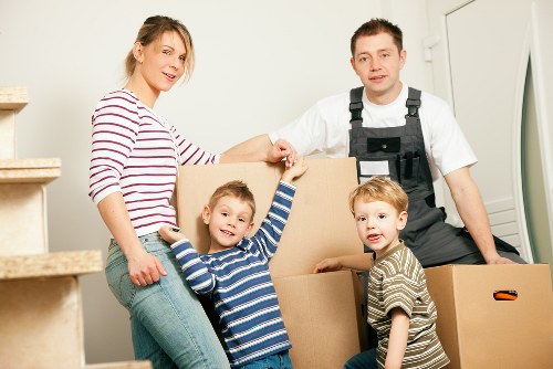 Mover carrying items from a flat with stairs in Earls Court during a same day removal