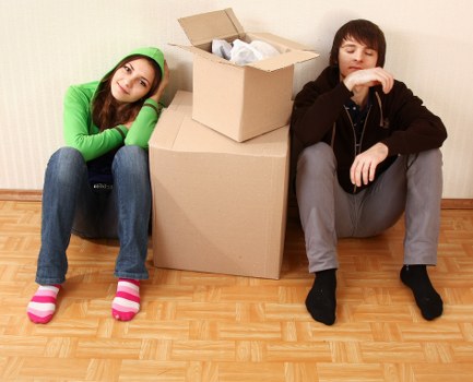 Moving boxes and furniture being loaded for a truck hire service