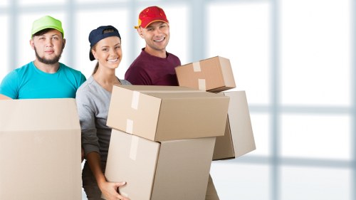 Loading furniture into a moving van in West London