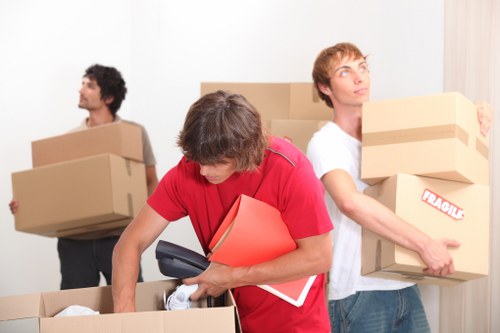 Local removal team organizing items for transport in Earls Court