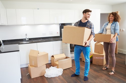 Professional movers preparing office furniture and equipment in Earls Court