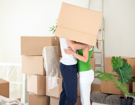 Packed boxes and furniture ready for a removal van move in Earls Court