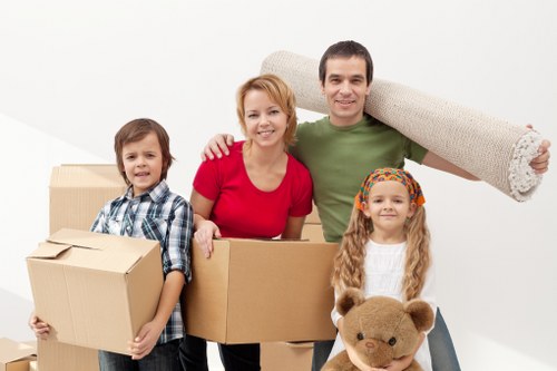 Moving boxes and furniture inside an Earls Court removal van