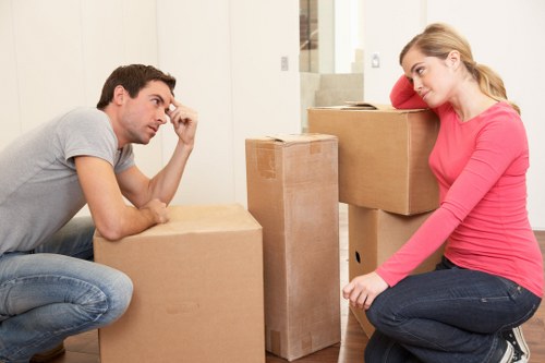 Packed office boxes and workstations ready for relocation in West London