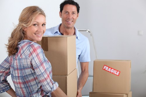 Office packing boxes and labels for a local business move